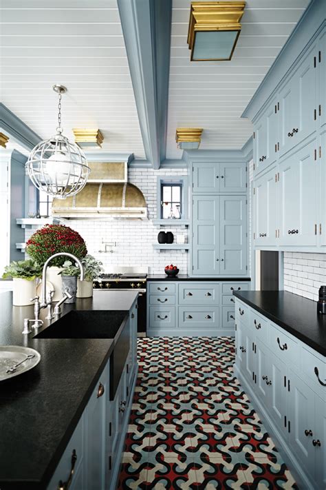 blue cabinets with dark countertops.